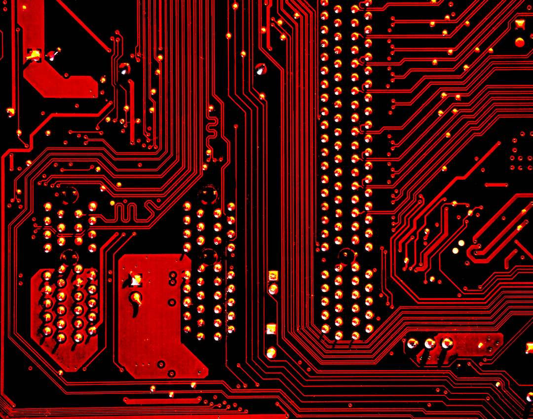 Circuit board photographed in red light.